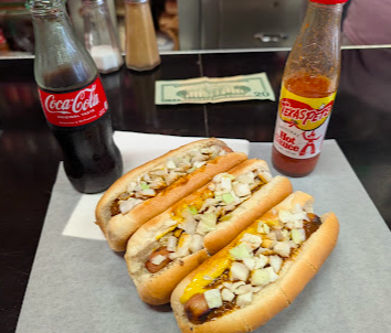 The Roast Grill signature dishes Hot Dog with Chili and Slaw
Homemade Potato Chips
Coca-Cola in Glass Bottles
